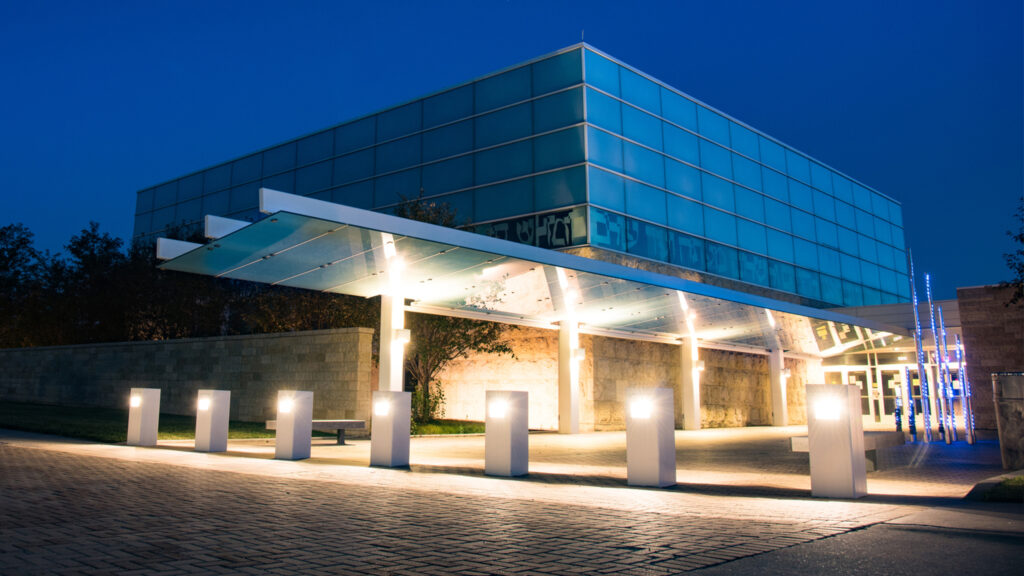 Nighttime photo of Temple Israel at Tri-Faith Center